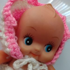 Vtg. Adorable Kewpie like doll in pink